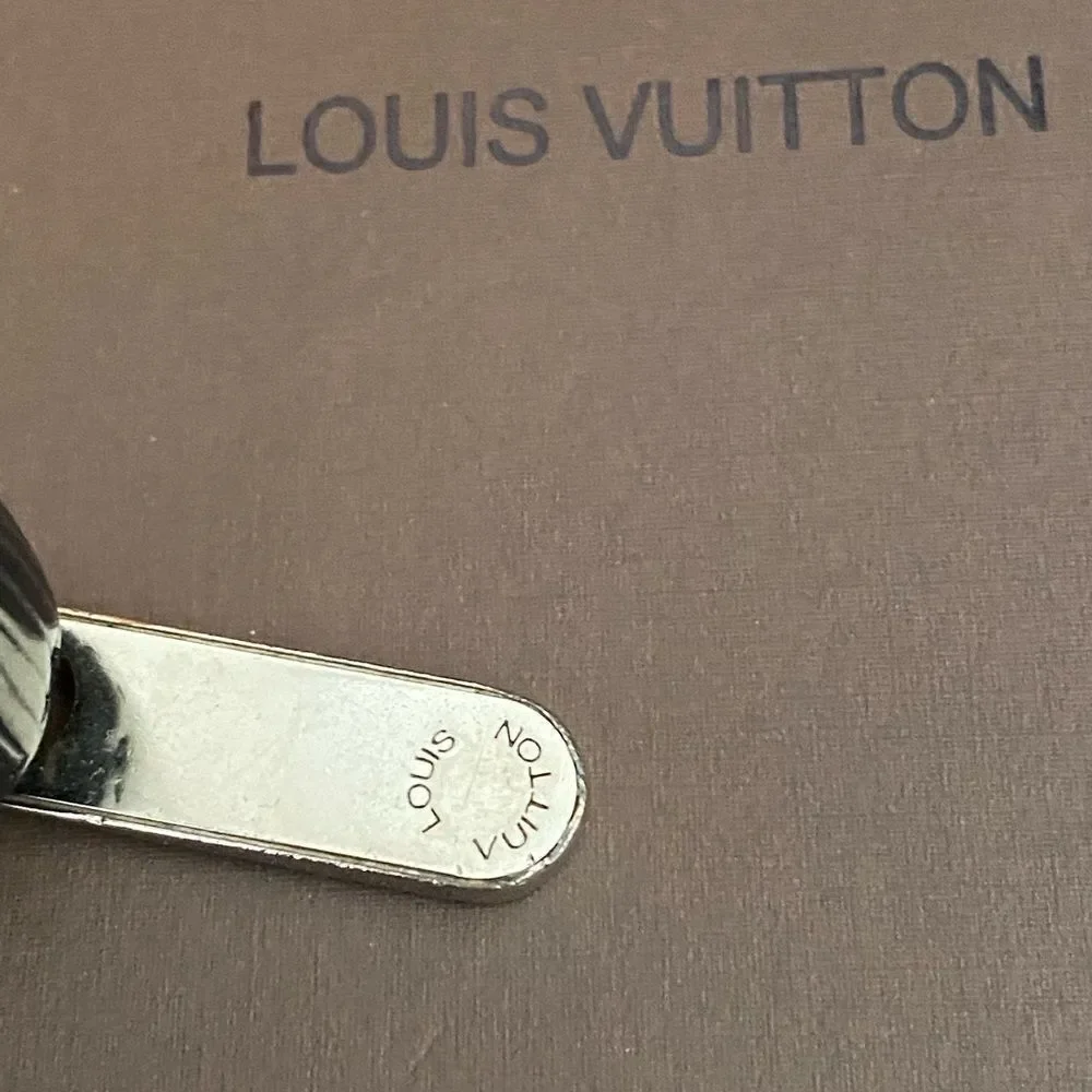 Auth Louis Vuitton black epi‎ wallet silver hardware.
